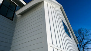 view from below of a house with James Hardie siding installed. the siding is white. 