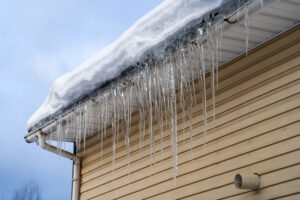 ice cause damage to your roof
