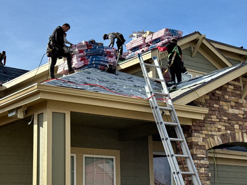 roofing replacement company working on installing a new roof on a residential home in Golden, CO