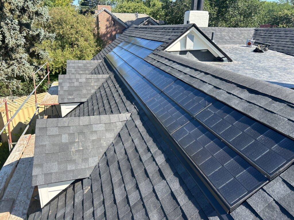 Integrated solar roofing shingles installed on a roof of a home in Golden, CO
