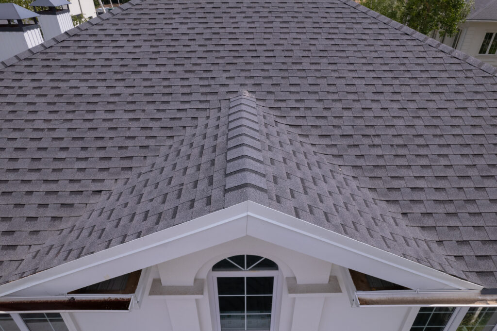 Close up view on asphalt roofing shingles after a roofing inspection